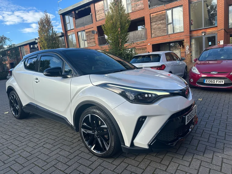 Front-quarter view of the white Toyota C-HR GR Sport teaching car.