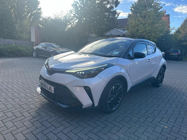 Opposite front-quarter view of the white Toyota C-HR GR Sport teaching car.